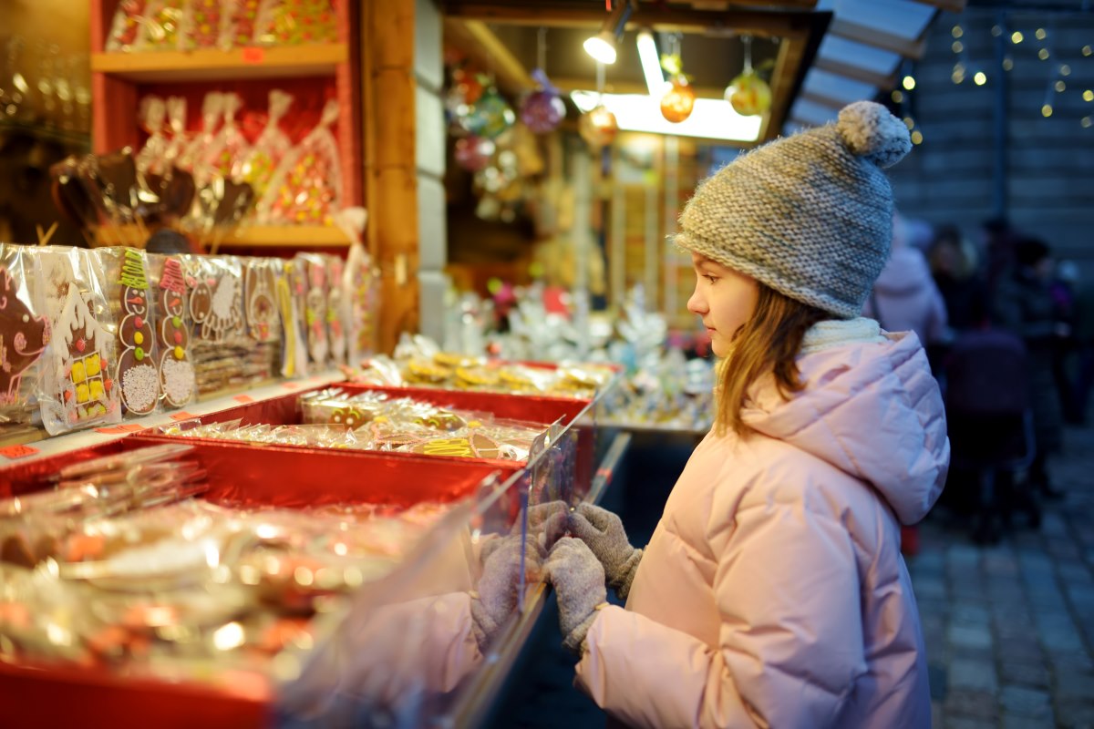 girl looking at candy stand